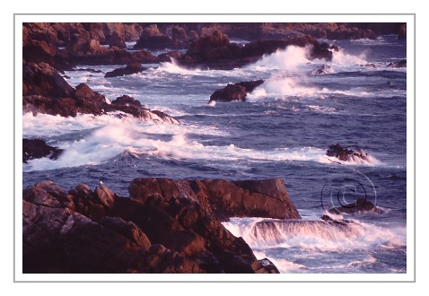 Ocean pictures of light along shore coastal rocks breaking waves