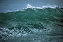 big cresting wave pulls up before slamming down on Mugu Beach